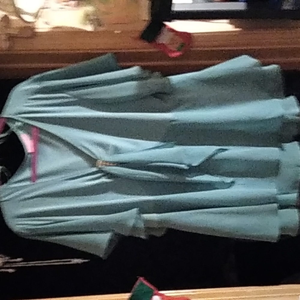 Woman within Ocean blue fancy top with decoration size 24